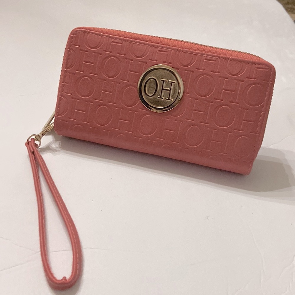 Clutch wristlet billfold. Has 2 separate compartments, stores all your cards.. - Picture 2 of 7